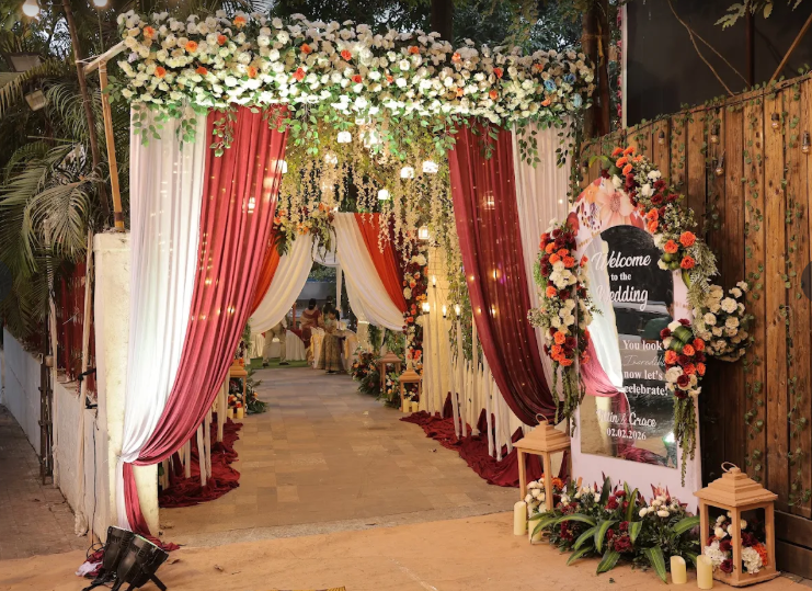 Floral welcome arch at the entrance to a wedding