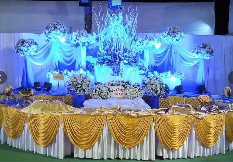 White and red floral stage set up for a live band with microphones